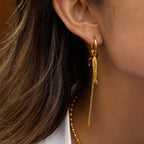 gold plated fish bead tassel earring shown from the side
