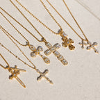Gold-tone clear-accent cross necklaces arranged together