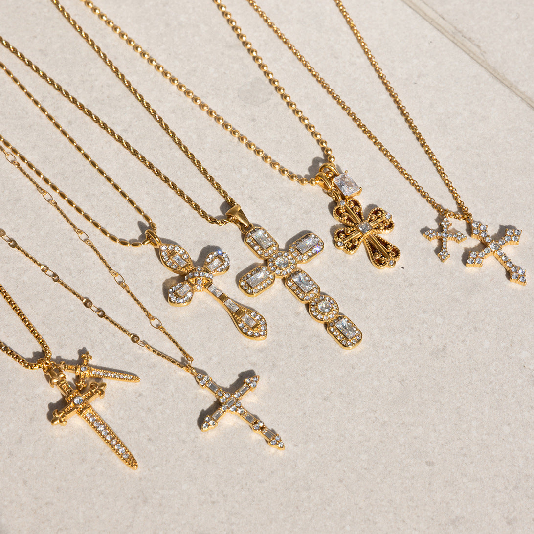 Gold-tone clear-accent cross necklaces arranged together