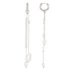 isolated silver-finish huggie earrings with white bead tassels