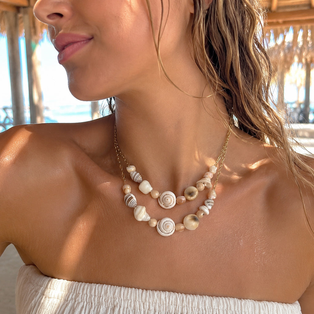 Shorter shell-bead necklace shown in layered styling