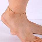 model wearing the polished metal bead drop anklet