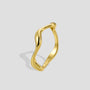 gold plated brass ring with a fluid sculptural wave profile