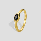 gold plated brass bezel ring with a faceted black stone