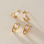 Marquise and rectangular two-stone studs on a textured surface
