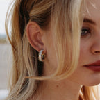 Side view of stone-lined gold tone hoop