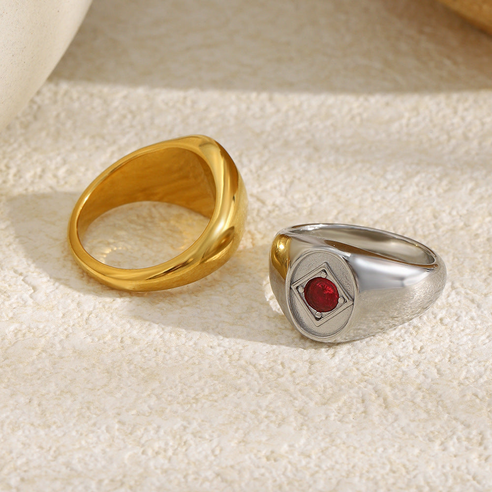 back and side views of polished red stone signet rings
