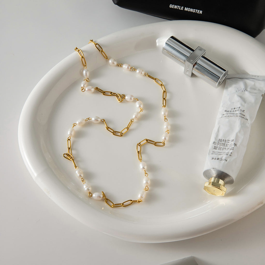 Freshwater pearl stainless steel necklace in a tabletop layout