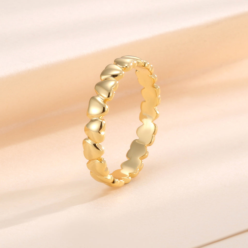 upright view of a gold plated continuous heart band ring