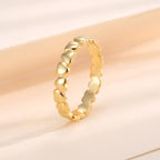 upright view of a gold plated continuous heart band ring