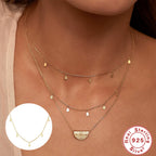 close styling view of the delicate gold plated teardrop necklace