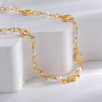 close-up of white beads and polished open-heart stations