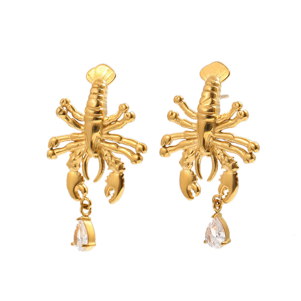 Detailed lobster earrings with clear drops on white