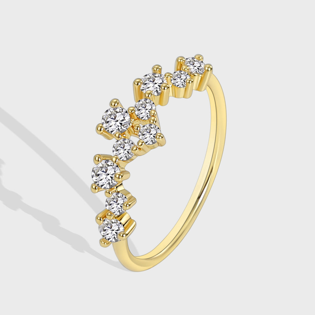 isolated gold plated brass ring with scattered clear-stone cluster