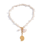 White bead necklace with hanging coastal charms