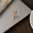 Small clear drop earrings viewed from above