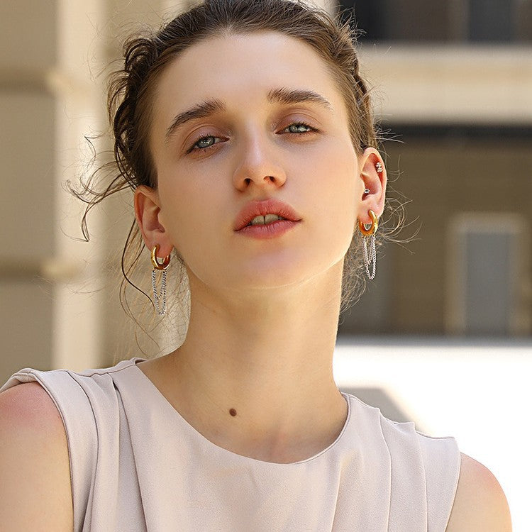 gold plated and silver chain hoop earrings worn on the ear