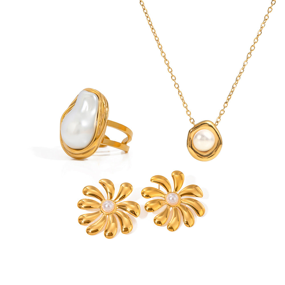 White-accent ring and pendant necklace shown with flower earring references