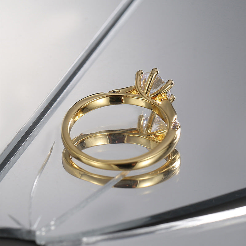 rear view of gold plated solitaire ring showing open basket setting