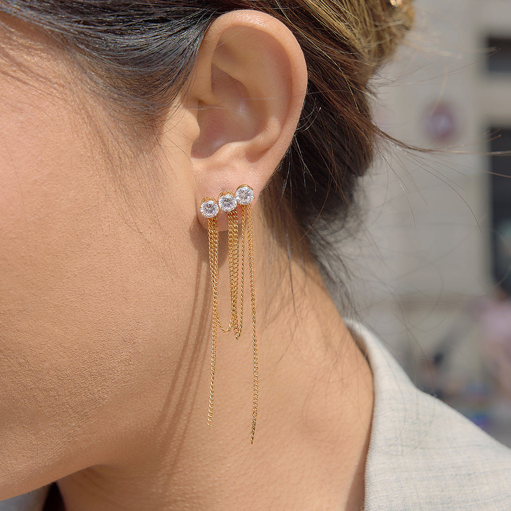 side view of three-stone cascading chain tassel earring