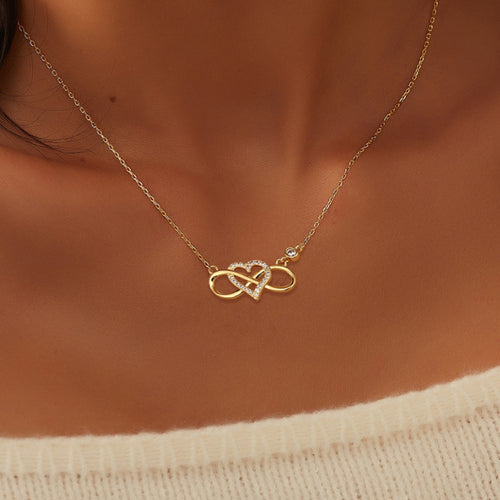 model wearing the gold plated infinity heart station necklace
