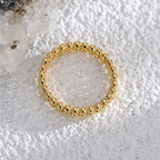 overhead view of textured beaded band around a crystal