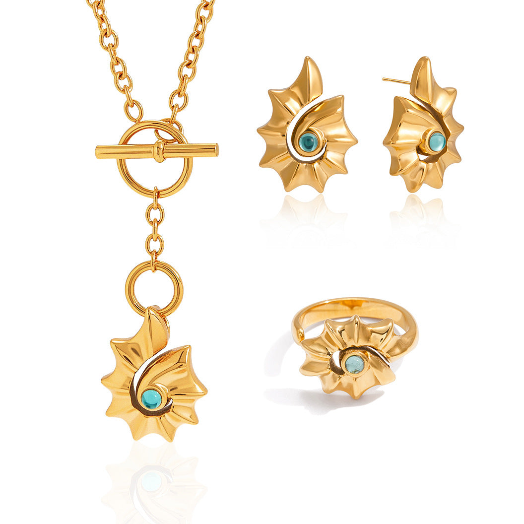 Spiral shell necklace and styled companion pieces