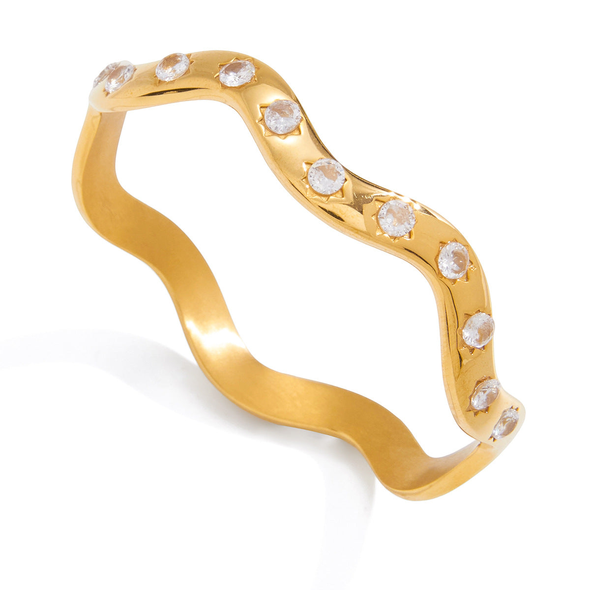 Wavy gold plated bangle on white