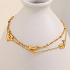Gold plated stainless steel dolphin double-strand bracelet styled view