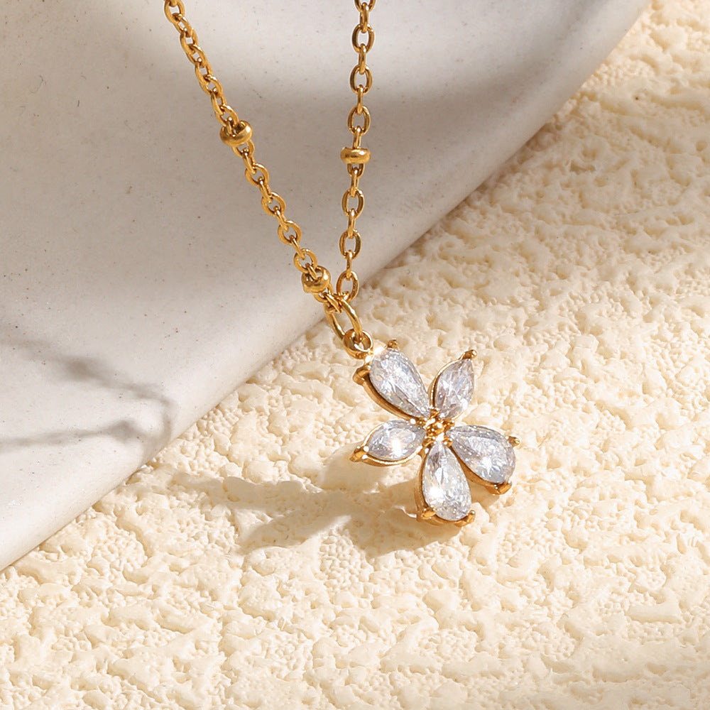 Clear petal flower pendant on a station chain