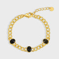 gold plated brass chain bracelet with three black agate cabochons