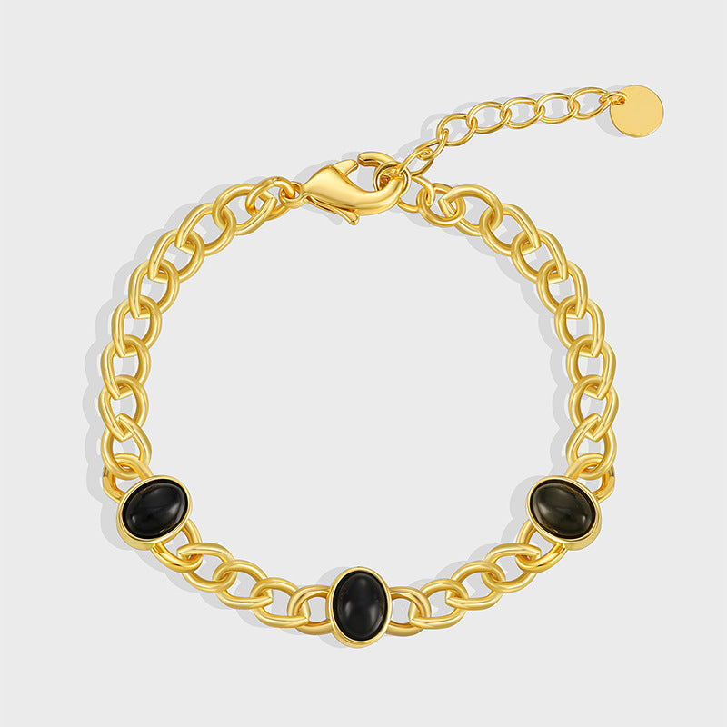 gold plated brass chain bracelet with three black agate cabochons