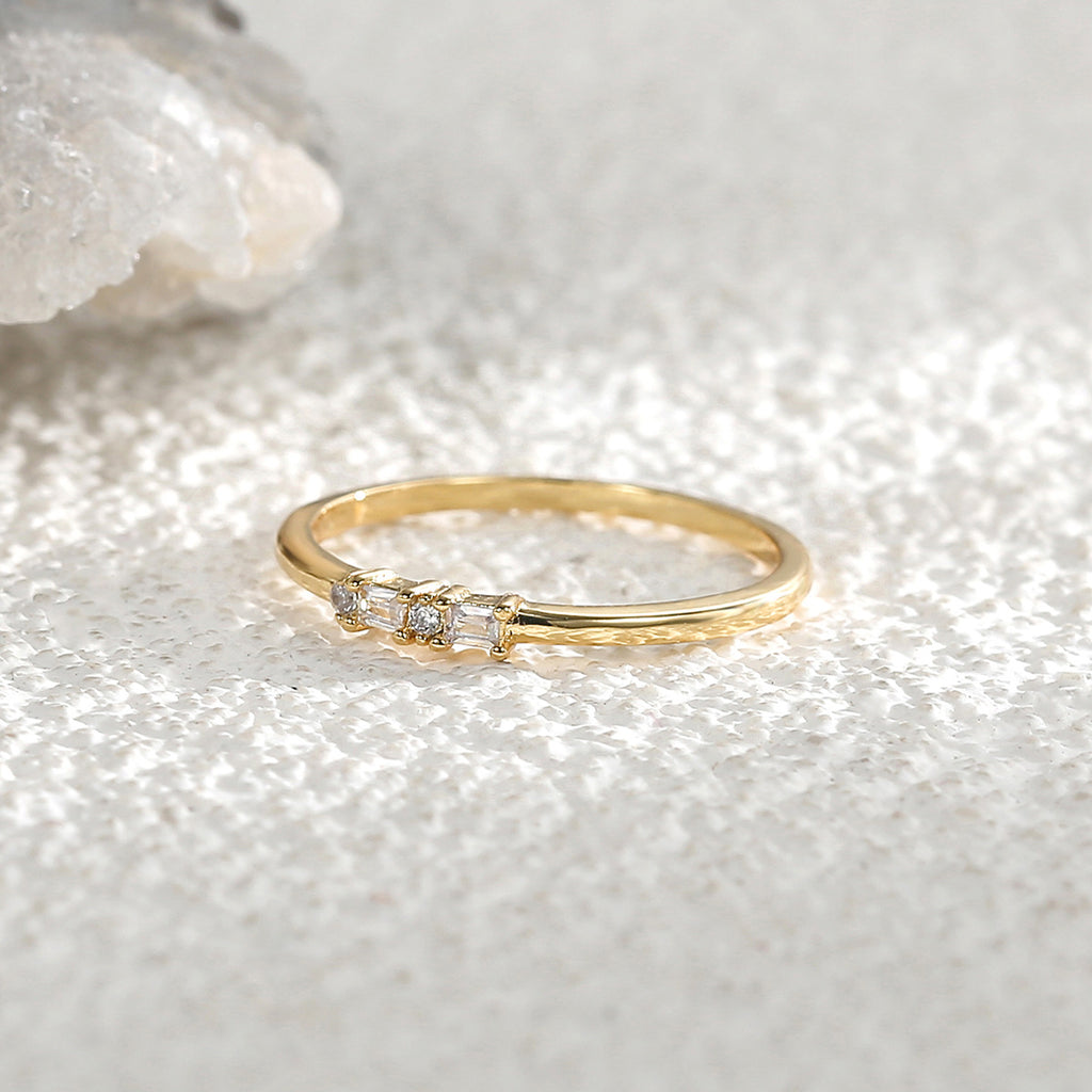 side view of slim mixed-cut clear-stone ring on crystal
