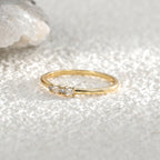 side view of slim mixed-cut clear-stone ring on crystal