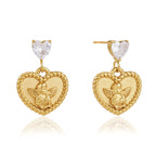 Front and side views of clear heart top and angel medallion