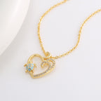 gold plated turtle pendant with clear-stone double wave detail