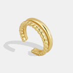 gold plated brass open ring with smooth and braided bands