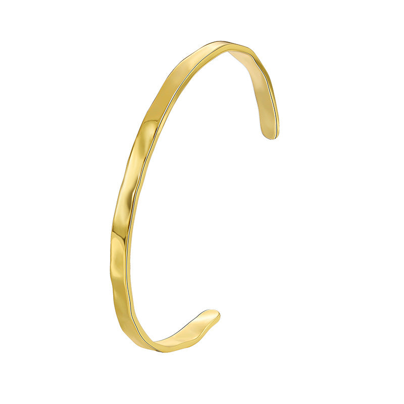 front profile of the gold plated faceted stacking bangle