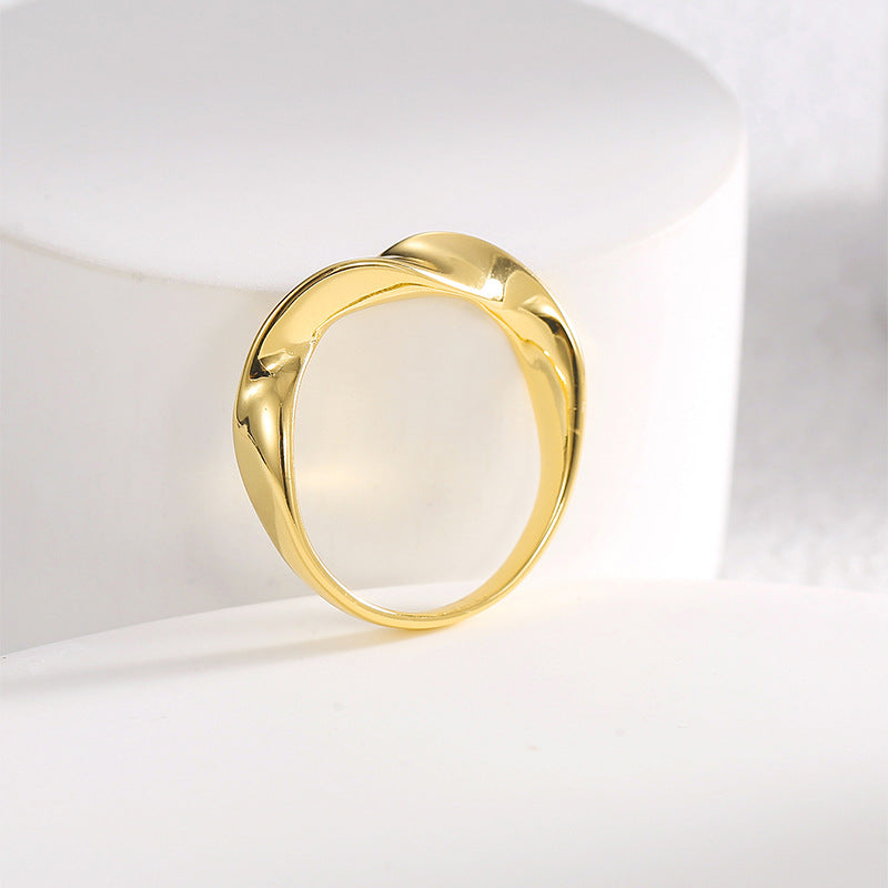 front view of polished stone-free sculptural band ring