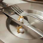 Gold-Tone Bee Pearl-Look Stainless Steel Stud Earrings – flat-lay view