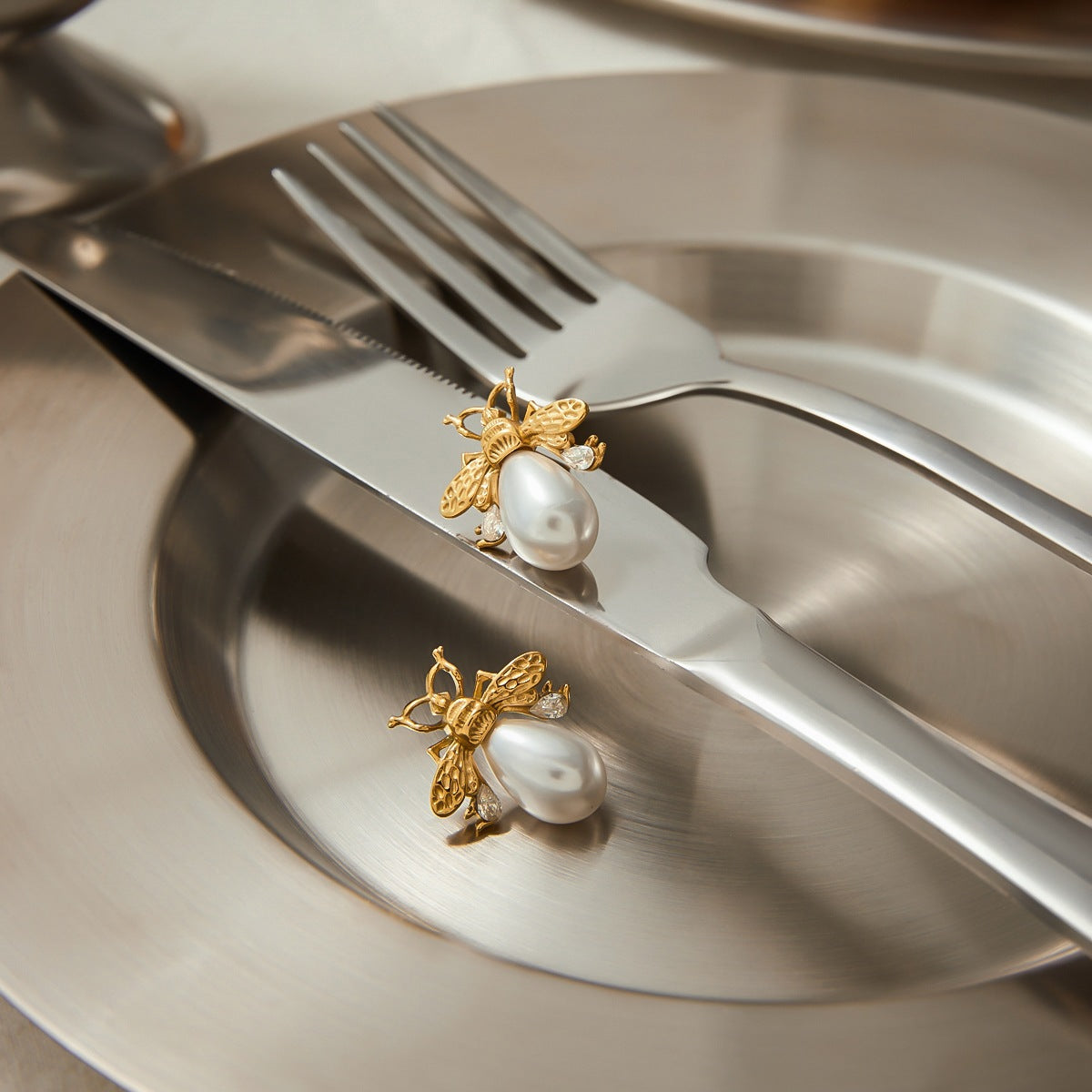 Gold-Tone Bee Pearl-Look Stainless Steel Stud Earrings – flat-lay view