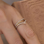 Layered chevron ring viewed from an angled hand position