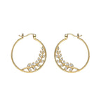 mirrored pair of clear stone leaf hoop earrings on white