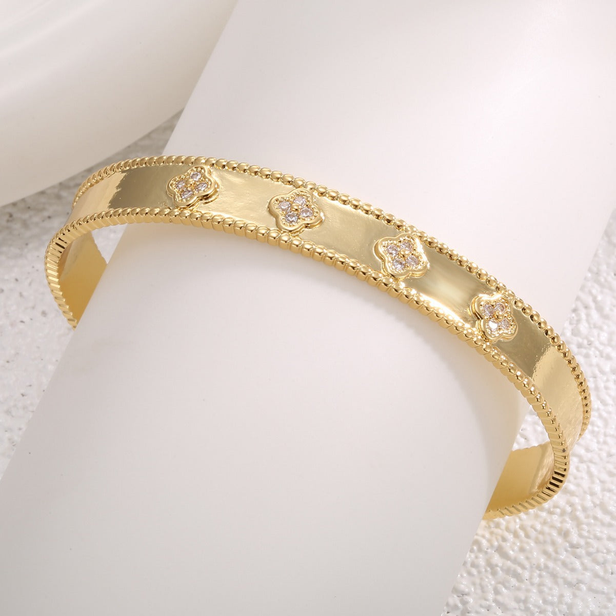 angled close view of the clover bangle and beaded borders