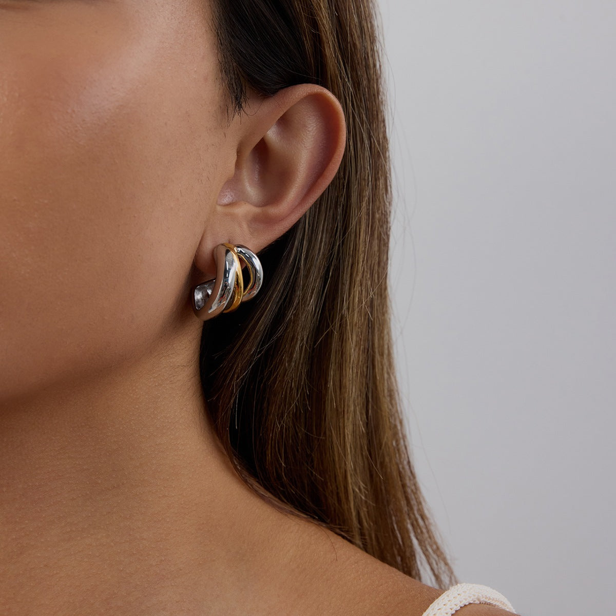 Two-Tone Layered Stainless Steel Huggie Hoop Earrings – styled view