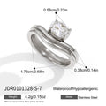 Silver tone double-band ring with clear solitaire measurements