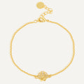 gold plated clear stone seashell station bracelet on white