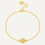 gold plated clear stone seashell station bracelet on white