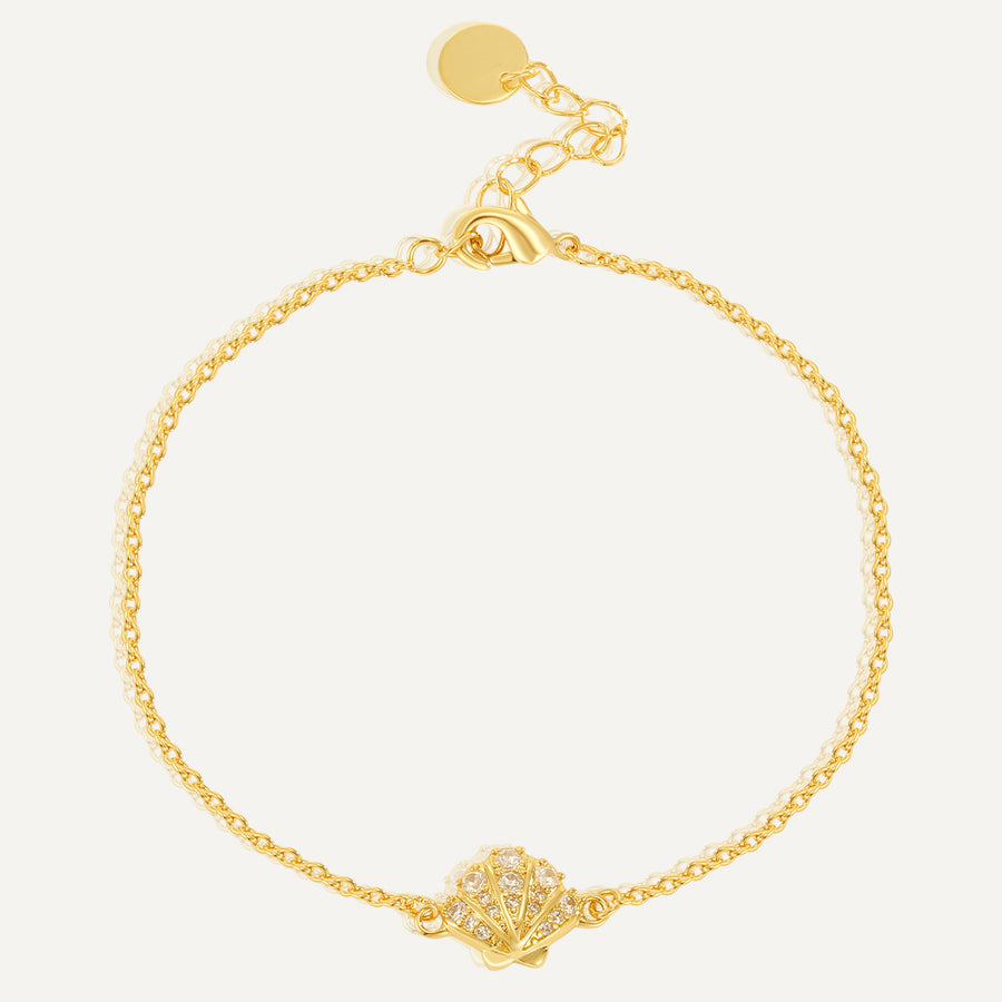 gold plated clear stone seashell station bracelet on white