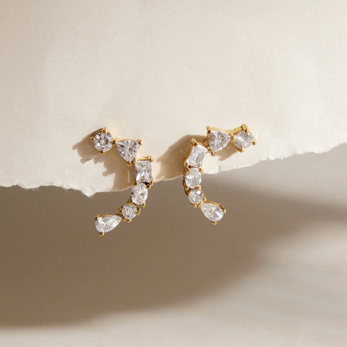 Pair of mixed-shape zirconia arc earrings